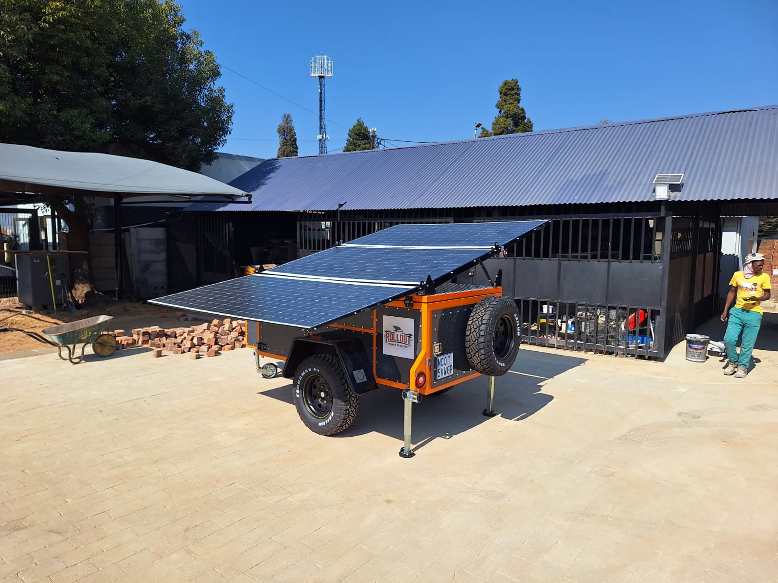 Rollout trailer panel array from behind