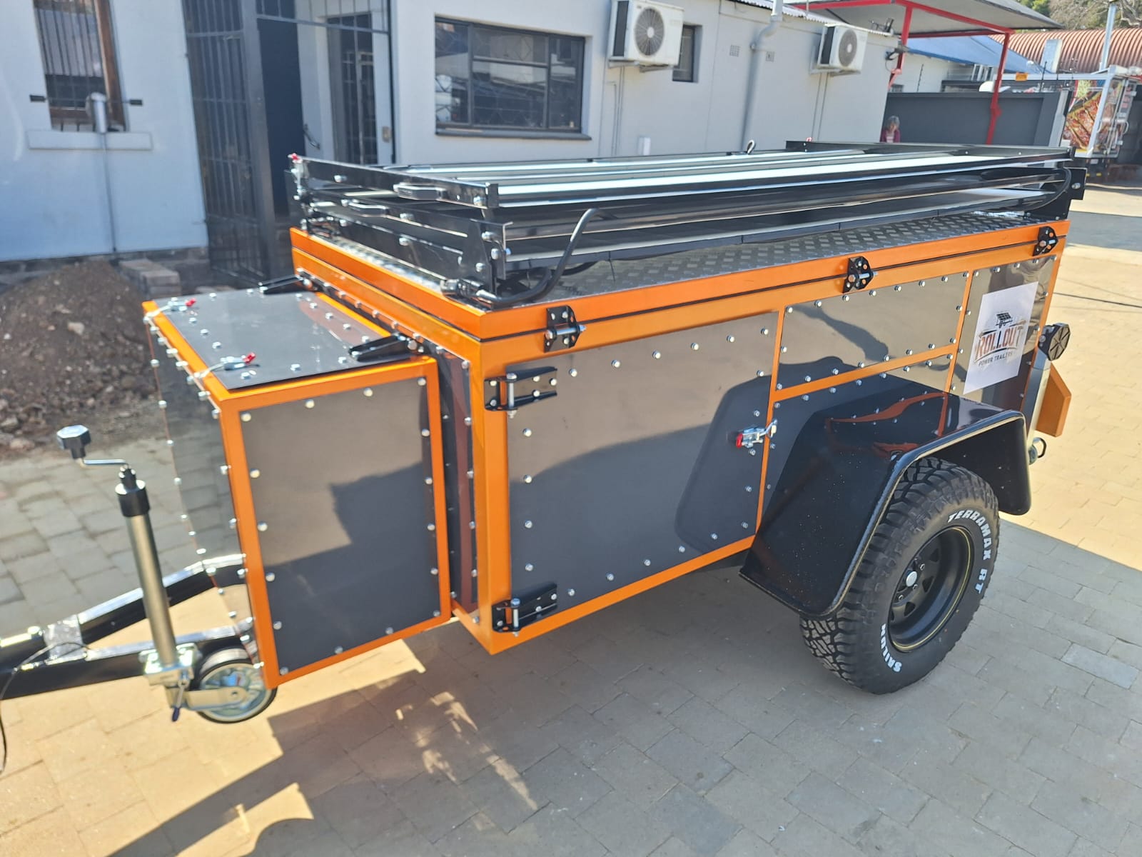 Rollout trailer stowed with side lockers open